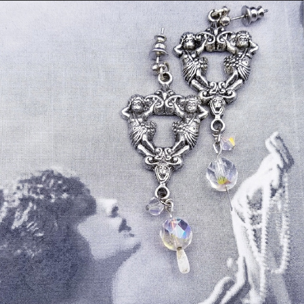 Vintage silver tone figural AB earrings